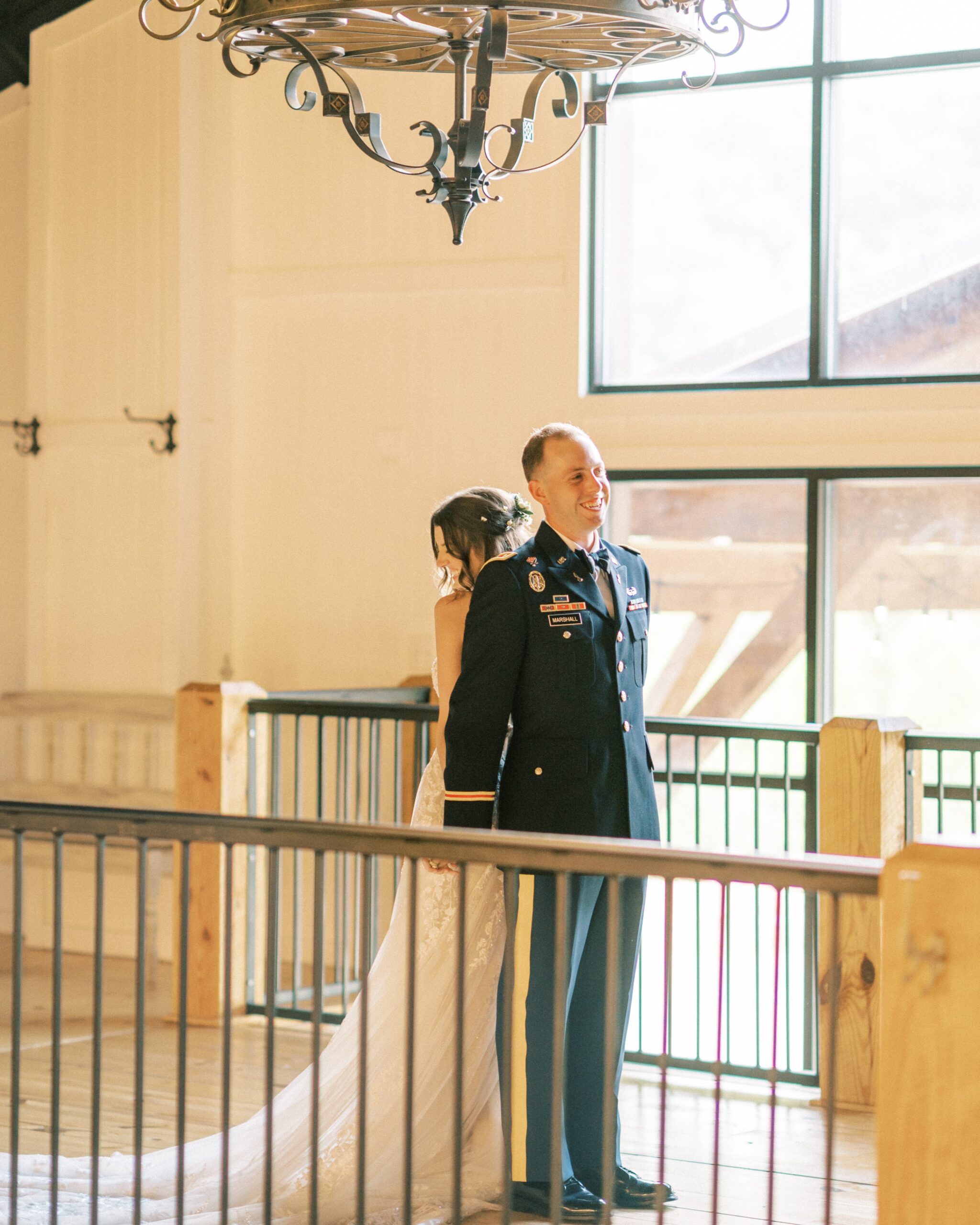A military groom and his bride at The Vineyard Hall - A Rustic Wedding Venue