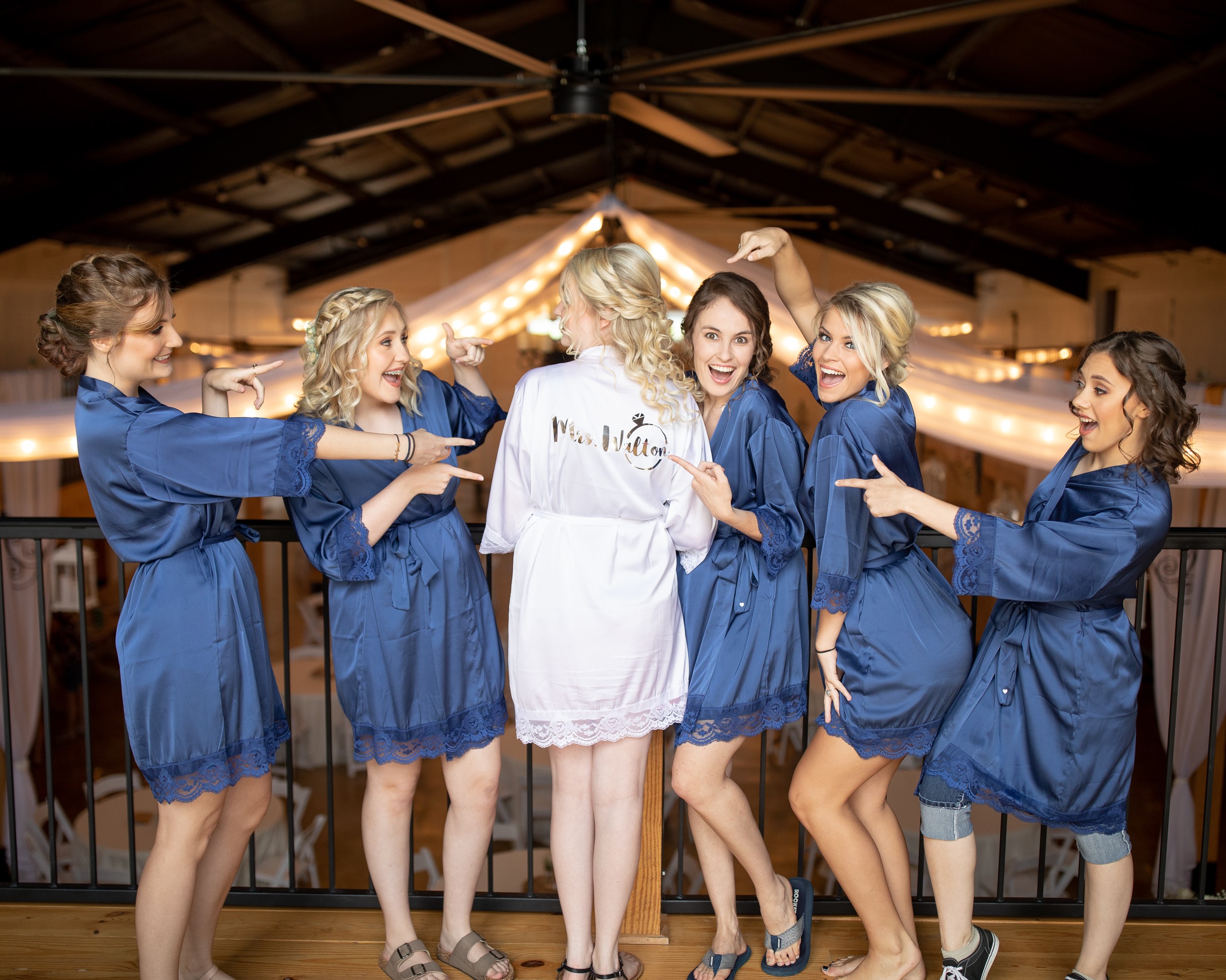 A bride and her bridesmaids at The Vineyard Hall - A Rustic Wedding Venue